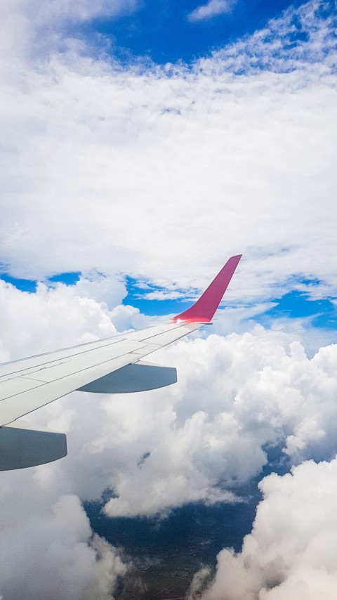 Kenya Airways Airplane in the Sky above the clouds